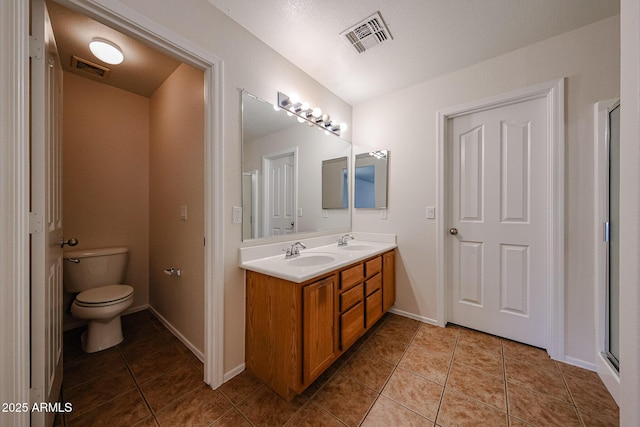 4804 S 25th Dr, Phoenix, AZ 85041 - bathroom featuring double vanity, tile patterned floors, toilet, and baseboards