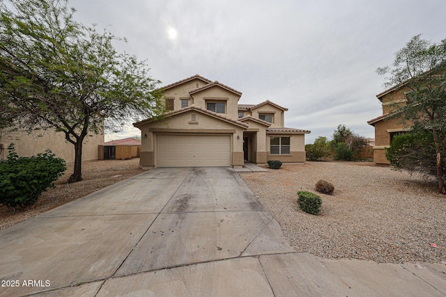 4804 S 25th Dr, Phoenix, AZ 85041 - traditional home featuring stucco siding, driveway, a tile roof, and a garage