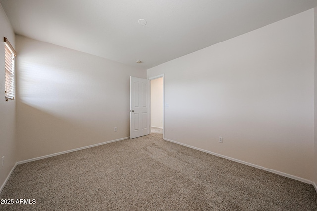 4804 S 25th Dr, Phoenix, AZ 85041 - spare room featuring light carpet and baseboards