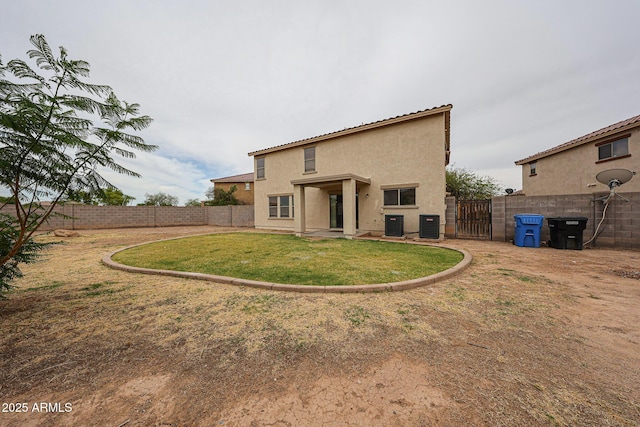 4804 S 25th Dr, Phoenix, AZ 85041 - rear view of house featuring a gate, stucco siding, and cooling unit