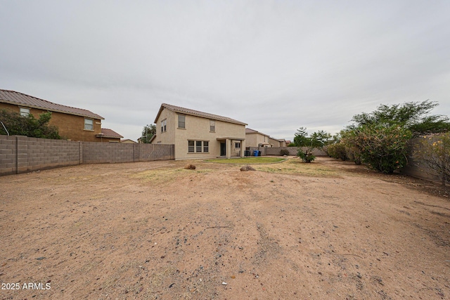 4804 S 25th Dr, Phoenix, AZ 85041 - back of property featuring a fenced backyard and stucco siding
