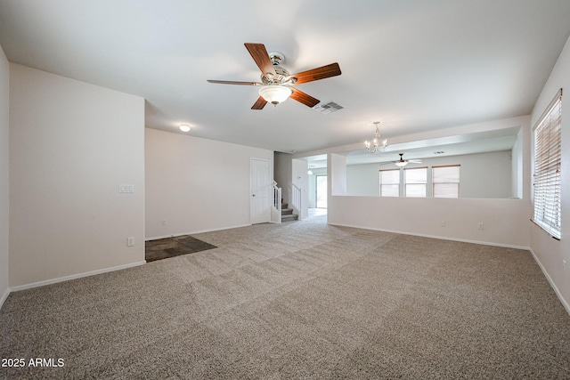 4804 S 25th Dr, Phoenix, AZ 85041 - unfurnished room featuring ceiling fan, a chandelier, stairs, and carpet floors