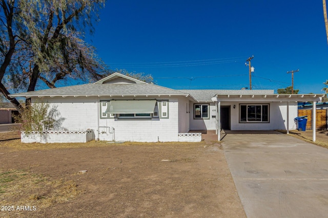 single story home with roof with shingles