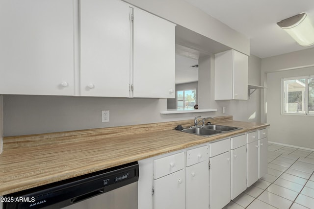 kitchen with dishwasher, light countertops, a sink, and white cabinetry