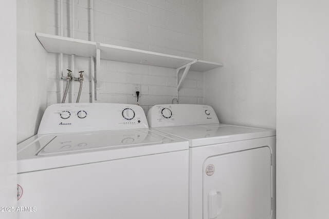 washroom with washer and dryer and laundry area