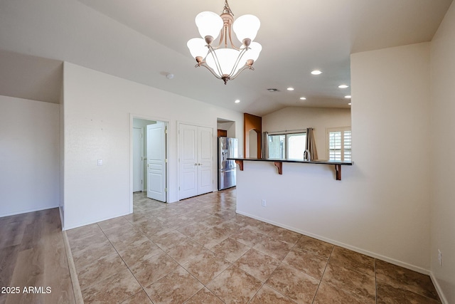 empty room with an inviting chandelier, visible vents, baseboards, recessed lighting, and vaulted ceiling