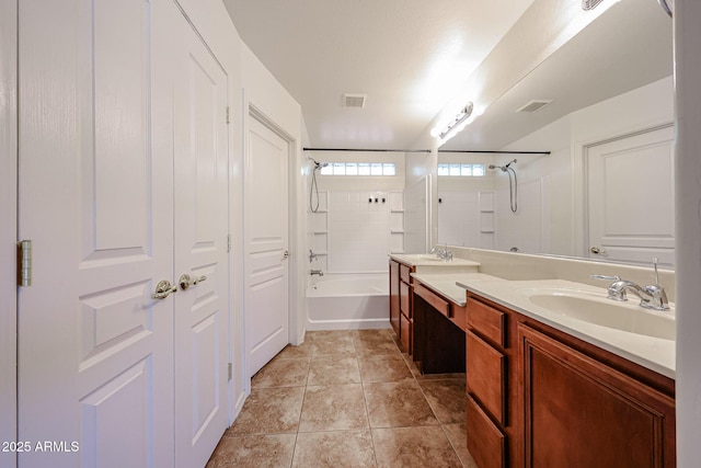 bathroom with a sink, bathing tub / shower combination, double vanity, and visible vents