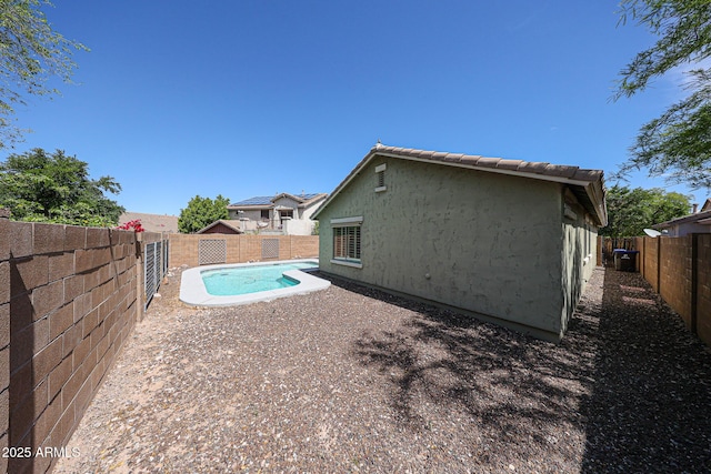 view of swimming pool featuring a fenced in pool, a fenced backyard, and a patio