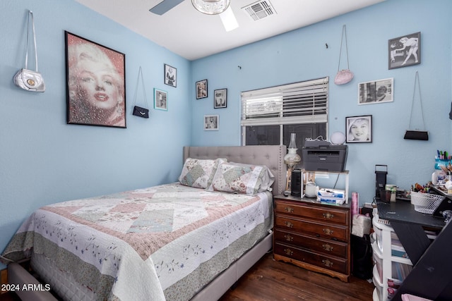 bedroom with ceiling fan and dark hardwood / wood-style flooring