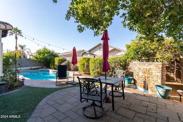 view of pool featuring a patio area