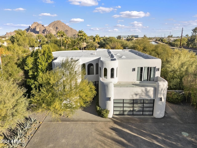 view of front of home featuring a mountain view and a garage