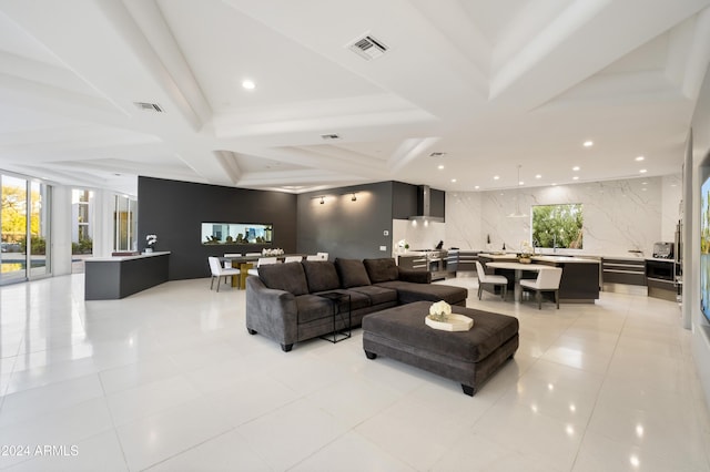 living area with light tile patterned floors, visible vents, coffered ceiling, and recessed lighting