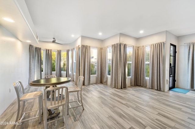 dining area featuring light wood finished floors and recessed lighting