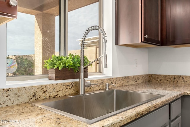 43142 N Outer Bank Dr, Anthem, AZ 85086 - interior details with a sink and dark brown cabinetry