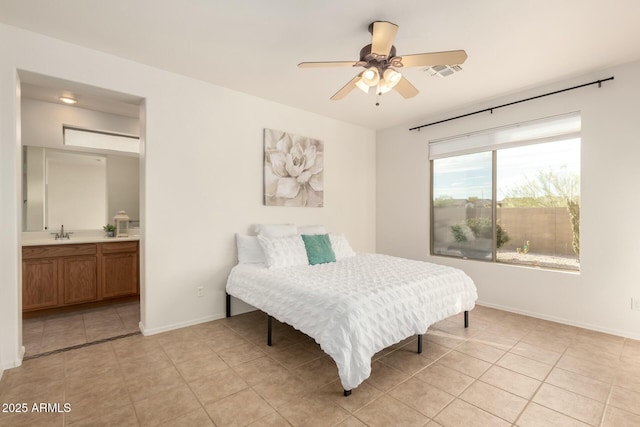 43142 N Outer Bank Dr, Anthem, AZ 85086 - bedroom featuring light tile patterned flooring, connected bathroom, a sink, baseboards, and visible vents