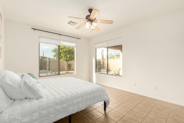 43142 N Outer Bank Dr, Anthem, AZ 85086 - bedroom featuring baseboards, visible vents, a ceiling fan, and light tile patterned floors