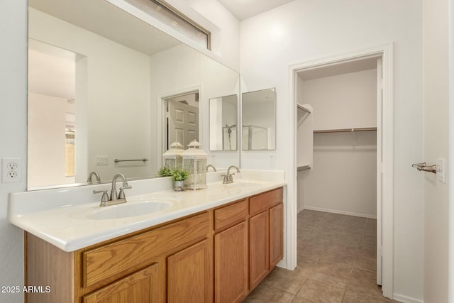 43142 N Outer Bank Dr, Anthem, AZ 85086 - full bathroom with a spacious closet, double vanity, a sink, and tile patterned flooring