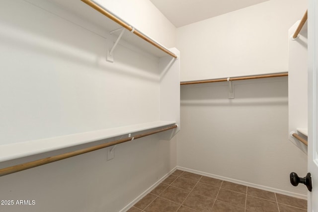 43142 N Outer Bank Dr, Anthem, AZ 85086 - spacious closet with dark tile patterned flooring
