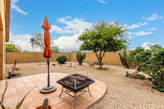 43142 N Outer Bank Dr, Anthem, AZ 85086 - view of patio / terrace with an outdoor fire pit and a fenced backyard