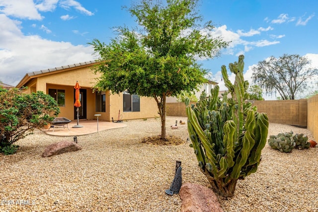 43142 N Outer Bank Dr, Anthem, AZ 85086 - back of house with a fenced backyard, stucco siding, and a patio