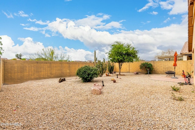 43142 N Outer Bank Dr, Anthem, AZ 85086 - view of yard with a fenced backyard, a fire pit, and a patio area