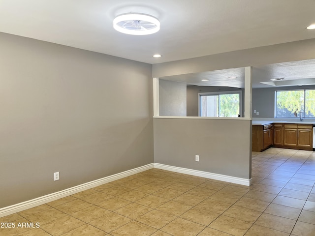 tiled empty room with sink