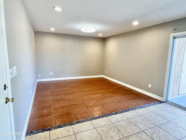 spare room featuring tile patterned flooring