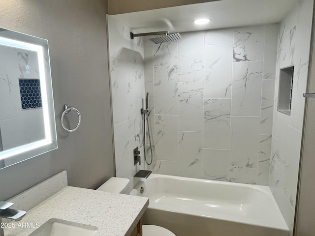 full bathroom with vanity, toilet, and tiled shower / bath combo