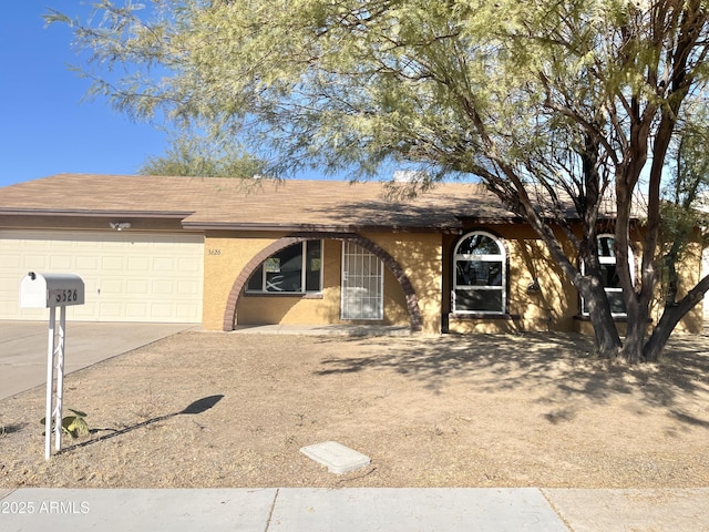 ranch-style house featuring a garage