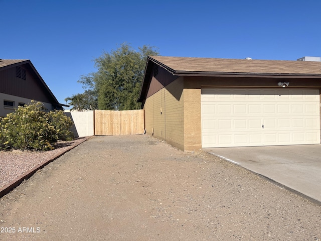 view of side of property featuring a garage