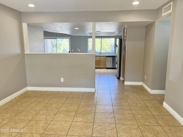 tiled empty room with sink