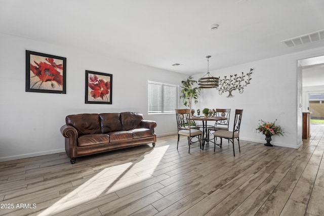 dining area with light hardwood / wood-style flooring