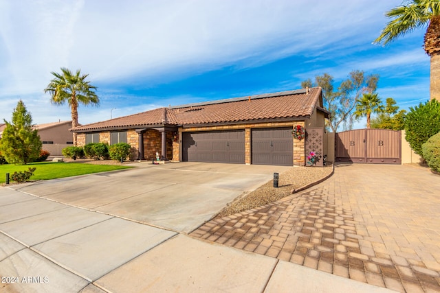 ranch-style home featuring a garage