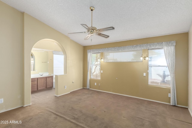 3140 N 114th Dr, Avondale, AZ 85392 - interior space featuring ceiling fan, a textured ceiling, baseboards, and a healthy amount of sunlight