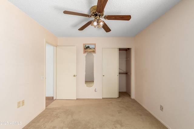 3140 N 114th Dr, Avondale, AZ 85392 - unfurnished bedroom featuring a closet, carpet, a textured ceiling, and ceiling fan