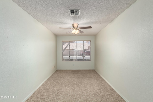 3140 N 114th Dr, Avondale, AZ 85392 - unfurnished room with visible vents, ceiling fan, baseboards, and a textured ceiling