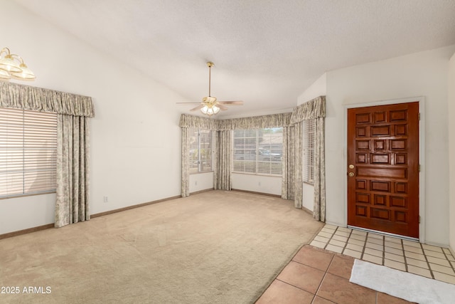 3140 N 114th Dr, Avondale, AZ 85392 - interior space with baseboards, ceiling fan, a textured ceiling, carpet floors, and vaulted ceiling