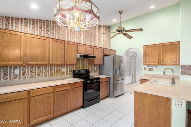3140 N 114th Dr, Avondale, AZ 85392 - kitchen with wallpapered walls, a sink, black / electric stove, and stainless steel refrigerator with ice dispenser