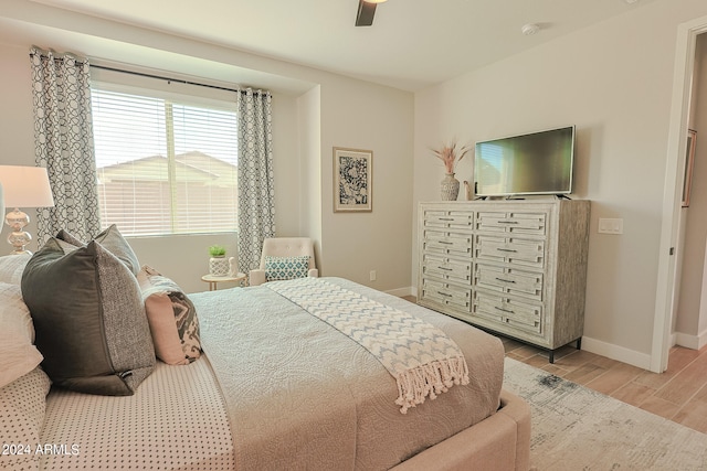 bedroom featuring ceiling fan and light wood-type flooring