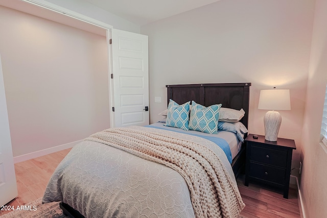 bedroom featuring hardwood / wood-style floors