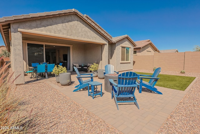 view of patio / terrace featuring an outdoor fire pit