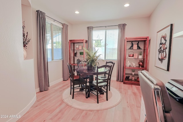 dining area with light hardwood / wood-style flooring