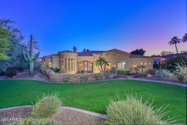 view of front of house with a lawn