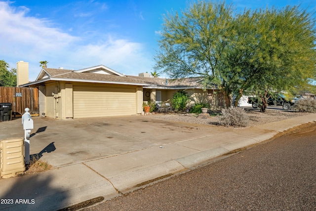 single story home featuring a garage