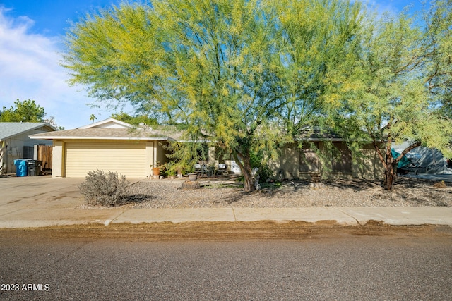 obstructed view of property featuring a garage