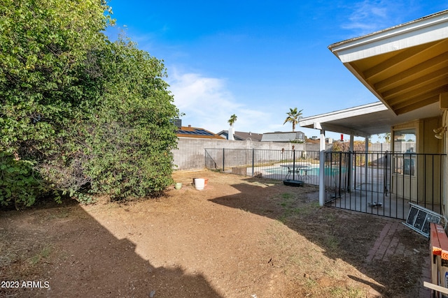 view of yard featuring a fenced in pool