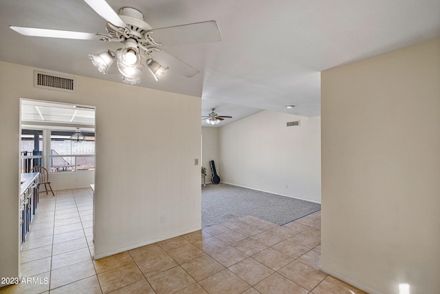 empty room with light colored carpet and ceiling fan