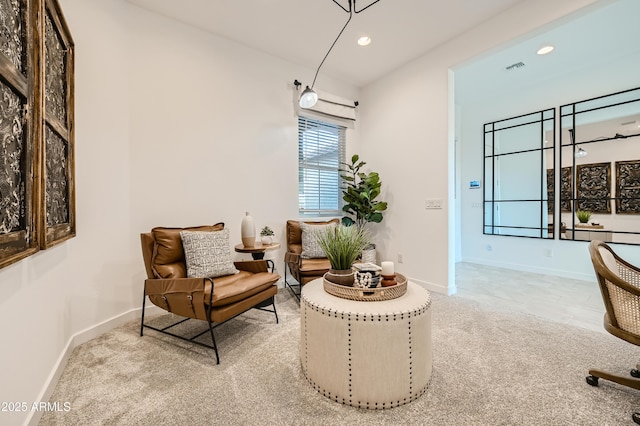 sitting room with visible vents, baseboards, and recessed lighting