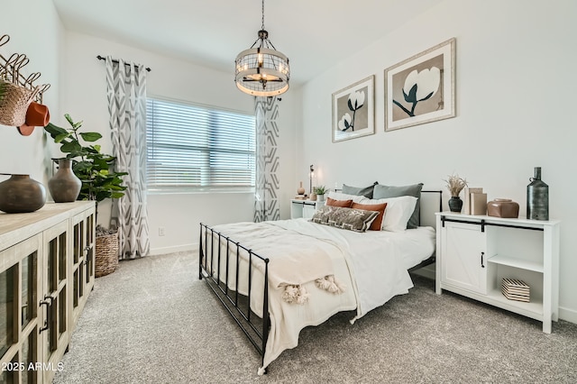 carpeted bedroom featuring baseboards