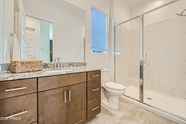 full bath featuring toilet, a marble finish shower, and vanity